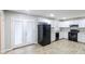 Modern kitchen with white cabinets, sleek appliances, and access to the backyard at 3903 Rex Rd, Rex, GA 30273