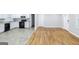 Kitchen and living room featuring white cabinets and updated appliances, and adjacent access at 3903 Rex Rd, Rex, GA 30273