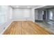 Bright living room featuring newly refinished hardwood floors and modern neutral paint at 3903 Rex Rd, Rex, GA 30273
