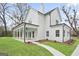 Exterior home view featuring a large backyard with a covered back porch and manicured lawn at 61 Main St, Moreland, GA 30259