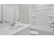 Sparkling bathroom offers a modern vanity and shower-tub combo with sleek, brushed nickel fixtures at 61 Main St, Moreland, GA 30259