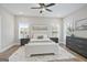 Bright bedroom with neutral decor, ceiling fan, hardwood flooring and generous natural light at 61 Main St, Moreland, GA 30259