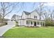 Beautiful two-story home with a detached garage and a large, well-maintained front yard at 61 Main St, Moreland, GA 30259