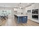 Spacious kitchen and dining area with an island, modern appliances, and pendant lights at 61 Main St, Moreland, GA 30259
