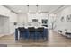 Stylish kitchen with an island, pendant lighting, and white cabinetry for a contemporary feel at 61 Main St, Moreland, GA 30259