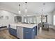 Kitchen island with white countertop and blue cabinets, and stainless steel dishwasher at 61 Main St, Moreland, GA 30259