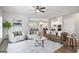 Inviting living room boasts modern furniture, stylish decor, and hardwood flooring throughout the space at 61 Main St, Moreland, GA 30259