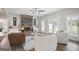 Cozy living room featuring a brick fireplace, stylish furniture, and ample natural light at 61 Main St, Moreland, GA 30259