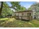 Spacious wooden deck with pergola, overlooking the backyard with ample space for outdoor enjoyment and relaxation at 3580 Dorris Cir, Douglasville, GA 30135