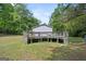 Backyard view of a large deck and fenced-in yard at 3580 Dorris Cir, Douglasville, GA 30135
