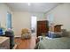 Comfortable bedroom with hardwood floors, armoire and walk-in closet entrance at 3580 Dorris Cir, Douglasville, GA 30135