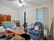 Bedroom with wood-look floors, off-white walls, a ceiling fan and lots of personal items at 3580 Dorris Cir, Douglasville, GA 30135