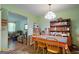 Cozy dining room featuring a wood table, chairs, colorful table cloth and a vintage hutch at 3580 Dorris Cir, Douglasville, GA 30135