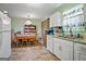 An eat in kitchen with granite countertops, vintage hutch and appliances at 3580 Dorris Cir, Douglasville, GA 30135