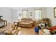 Comfortable living room with plush seating, laminate flooring, and natural light streaming through the windows at 3580 Dorris Cir, Douglasville, GA 30135