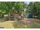 Exterior view of 2 storage sheds on a level lot with mature trees at 3580 Dorris Cir, Douglasville, GA 30135