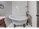 Elegant bathroom featuring a clawfoot tub and classic fixtures at 4173 Raphael St, Covington, GA 30014