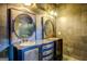 Elegant bathroom vanity with round mirrors and vintage lighting creating a sophisticated and unique style at 4173 Raphael St, Covington, GA 30014