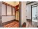 Walk-in closet with custom shelving and hardwood floors at 4173 Raphael St, Covington, GA 30014