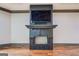 Close-up of a tiled fireplace with a mounted television above at 4173 Raphael St, Covington, GA 30014