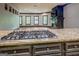 Gourmet kitchen featuring gas range, granite countertops, and dark wood cabinetry at 4173 Raphael St, Covington, GA 30014