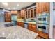 Spacious kitchen features wooden cabinets, stainless steel appliances, and granite countertops at 4173 Raphael St, Covington, GA 30014