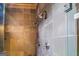 Tiled shower featuring dual shower heads and glass enclosure, offering a luxurious bathing experience at 4173 Raphael St, Covington, GA 30014