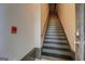 Interior shot of a staircase with wooden handrail and visible fire alarm at 4173 Raphael St, Covington, GA 30014