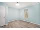 Bedroom featuring hardwood floors, fresh paint, and bright window at 3118 Rockbridge Rd, Avondale Estates, GA 30002