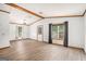 Spacious living room with new floors, ample natural light, and vaulted ceilings with exposed beams at 3118 Rockbridge Rd, Avondale Estates, GA 30002
