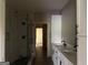 Bathroom featuring tiled walk-in shower and double sink vanity at 135 Church St, Palmetto, GA 30268
