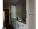 Bathroom featuring double sink vanity and shaker cabinets at 135 Church St, Palmetto, GA 30268