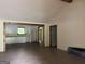 Open-concept living room with hardwood floors, connecting seamlessly to the kitchen and hallway at 135 Church St, Palmetto, GA 30268