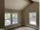 Bright living room featuring high ceilings, wood beam, and multiple windows bringing in natural light at 135 Church St, Palmetto, GA 30268