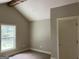 Neutral living space with vaulted ceiling, wood beam and bright white trim at 135 Church St, Palmetto, GA 30268