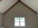 Vaulted room with wood beams and a window at 135 Church St, Palmetto, GA 30268