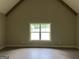 Vaulted room with wood beams and a window at 135 Church St, Palmetto, GA 30268