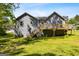 Exterior view of the home's back with a deck and stairs at 231 Breckenridge Ln, Powder Springs, GA 30127