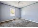 Bedroom featuring neutral carpet, a ceiling fan, and light blue painted walls at 231 Breckenridge Ln, Powder Springs, GA 30127