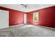 Primary bedroom with carpet flooring and a bright window at 231 Breckenridge Ln, Powder Springs, GA 30127
