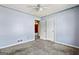 Bedroom featuring neutral carpet, a ceiling fan, and light blue painted walls at 231 Breckenridge Ln, Powder Springs, GA 30127