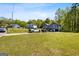 Residential street view of a two-story home with an attached garage and a well-maintained lawn at 231 Breckenridge Ln, Powder Springs, GA 30127