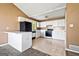 Traditional kitchen with white cabinets, black appliances, and tile flooring at 231 Breckenridge Ln, Powder Springs, GA 30127