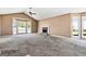 Spacious living room with vaulted ceilings, fireplace, large windows offering natural light and neutral carpet at 231 Breckenridge Ln, Powder Springs, GA 30127