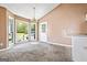 Bright breakfast area with bay windows, vaulted ceilings, neutral walls, and an adjacent kitchen counter at 231 Breckenridge Ln, Powder Springs, GA 30127