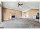 Expansive living room with stone fireplace, vaulted ceiling, bay windows, and open access to a kitchen bar at 231 Breckenridge Ln, Powder Springs, GA 30127