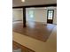 Spacious basement with wood-look flooring, natural light, and a convenient access door at 854 Clearwater Rd, Sharpsburg, GA 30277