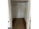 Spacious walk-in closet with ample storage and white slat doors at 854 Clearwater Rd, Sharpsburg, GA 30277