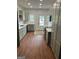 Modern kitchen with gray cabinets, white countertops, stainless steel appliances, and wood-look flooring at 854 Clearwater Rd, Sharpsburg, GA 30277