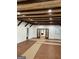Spacious room with wood-look floors, wood beam ceilings, recessed lights and neutral walls at 854 Clearwater Rd, Sharpsburg, GA 30277